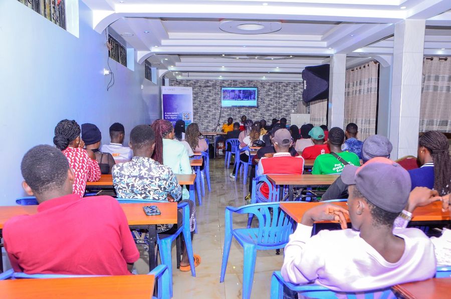Audience seated in a hall at a nano community event